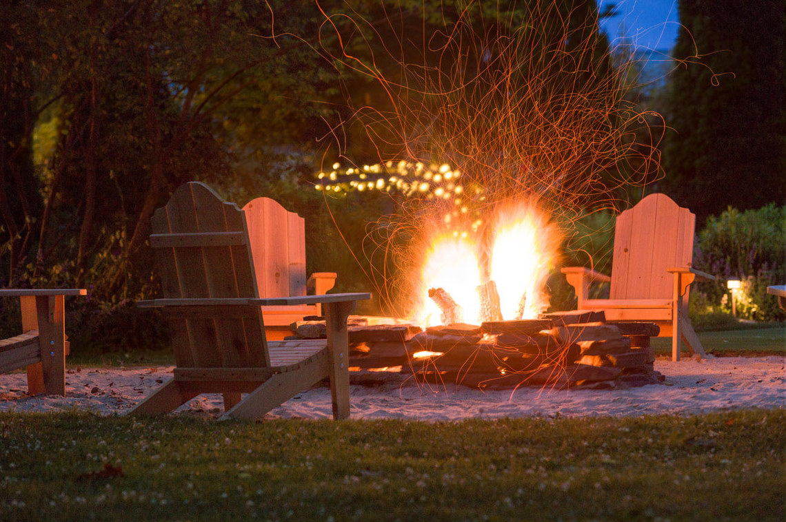 Chairs around a bonfire